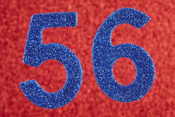 Numéro 56 couleur bleue sur un fond rouge. Anniversaire . — Photo