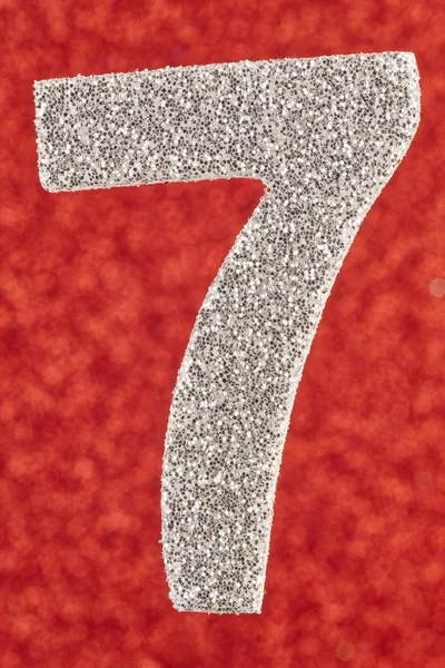 Number seven silver color over a red background. Anniversary. — Stock Photo, Image