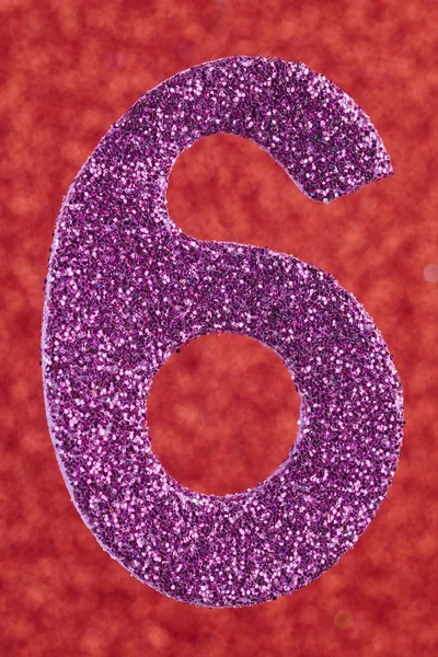 Number six purple color over a red background. Anniversary. — Stock Photo, Image