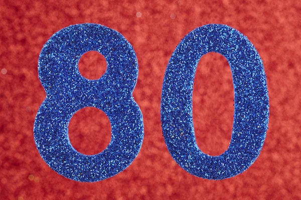 Número ochenta color azul sobre un fondo rojo. Aniversario . — Foto de Stock