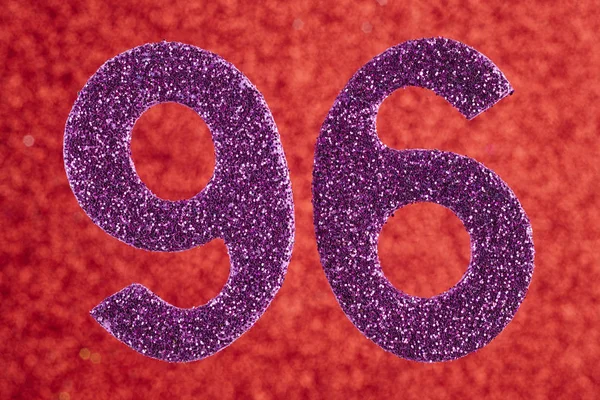 Number ninety-six purple color over a red background. Anniversar — Stock Photo, Image