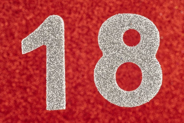 Number eighteen silver color over a red background. Anniversary. — Stock Photo, Image