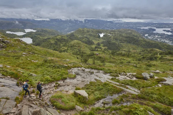 Norwegian landscape with hikers. Ulriken mountain. Bergen surrou — Stock Photo, Image