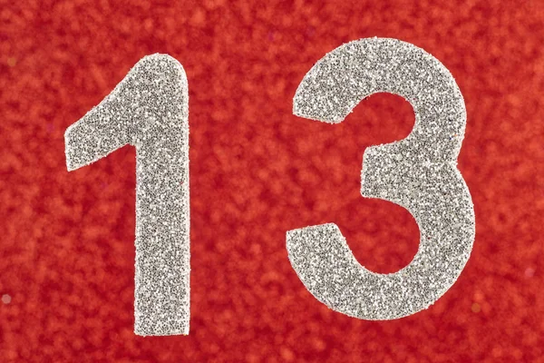 Number thirteen silver color over a red background. Anniversary. — Stock Photo, Image