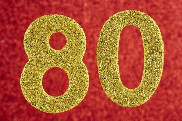 Zahl achtzig gelbe Farbe auf rotem Hintergrund. Jubiläum. — Stockfoto
