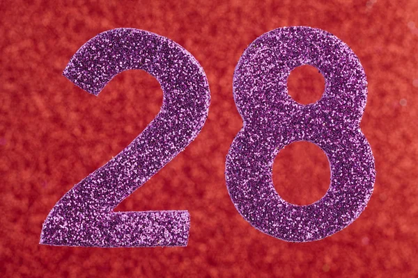 Número vinte e oito cor roxa sobre um fundo vermelho. Atiradores. — Fotografia de Stock