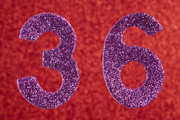 Antal trettiosex purplew färg över en röd bakgrund. Årsjubileum — Stockfoto