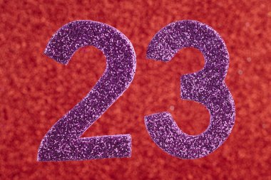 Yirmi üç mor kırmızı bir arka plan üzerinde numara. Yıldönümü. 