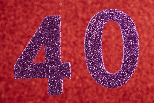 Numero quaranta colore viola su uno sfondo rosso. Anniversario. Ho! — Foto Stock
