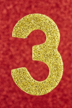 Üç sarı renk kırmızı bir arka plan üzerinde numara. Yıldönümü. 