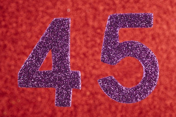 Number forty-five purple color over a red background. Anniversar