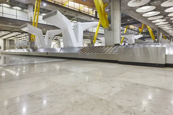 International airport baggage belt claim area. Nobody. Travel ba