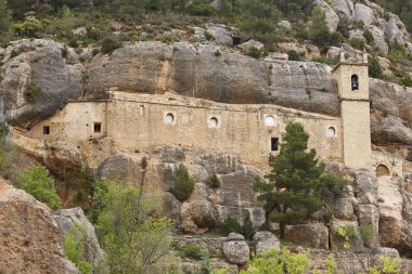 Sanctuary excavated on the rock. La Balma, Castellon. Spain clipart