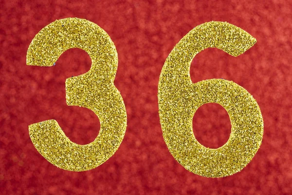 Número treinta y seis color amarillo sobre un fondo rojo. Aniversario —  Fotos de Stock
