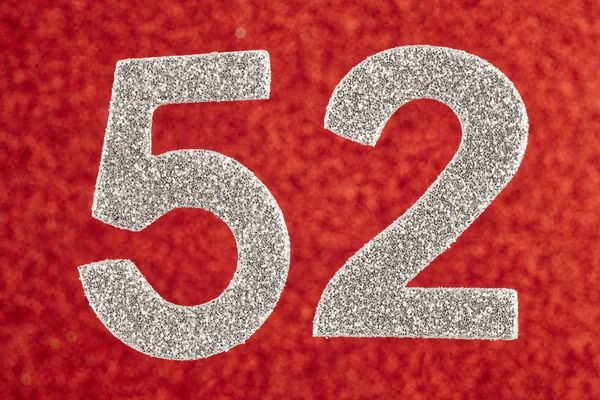 Αριθμός πενήντα δύο ασημένια πάνω σε κόκκινο φόντο. Επέτειος. — Φωτογραφία Αρχείου