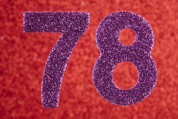 Numero 78 colore viola su uno sfondo rosso. Anniver — Foto Stock