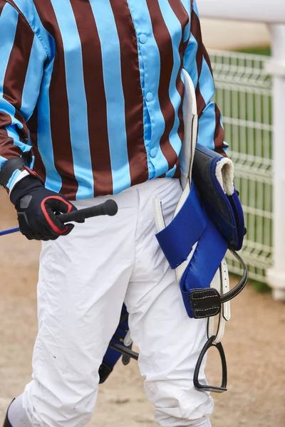 Jockey detail after the race. Hippodrome background. Racehorse. — Stock Photo, Image