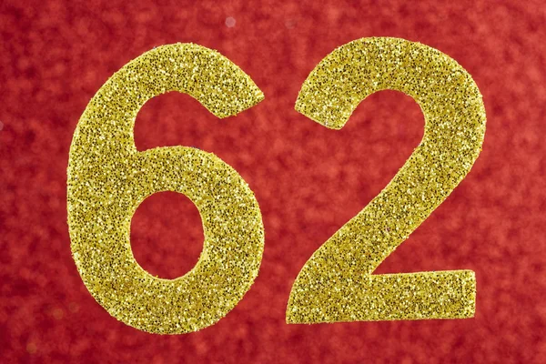 Number sixty-two golden color over a red background. Anniversary — Stock Photo, Image