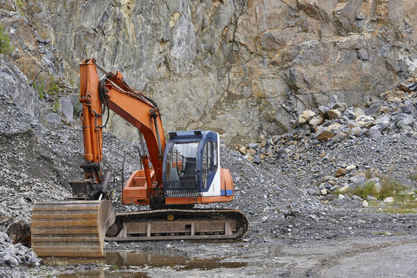 Quarry aggregate with heavy duty machinery. Construction industr