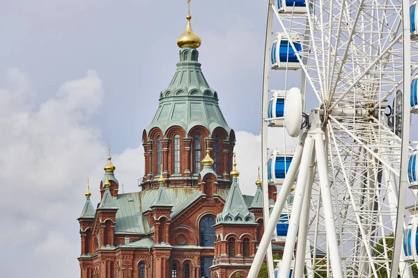 Helsinki skyline city center. Big wheel and Uspenki cathedral