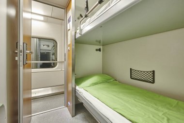 Train berth corridor indoor with two beds. Travel background.  clipart