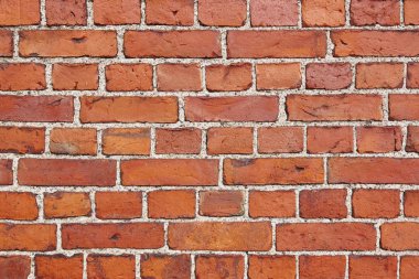 Turuncu dokulu tuğla duvar detay. İnşaat arka planı