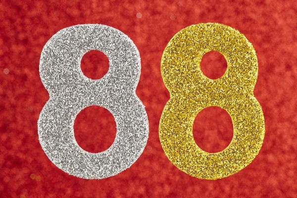 Number eighty-eight silver gold over a red background. Anniversa — Stock Photo, Image