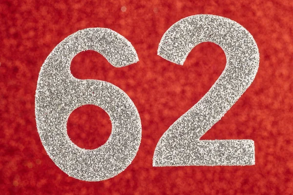 Number sixty-two silver color over a red background. Anniversary — Stock Photo, Image