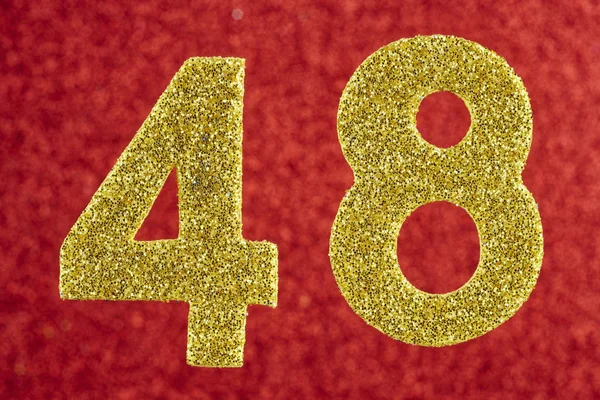 Number forty-eight gold color over a red background. Anniversary — Stock Photo, Image