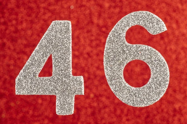 Numéro 46 couleur argent sur fond rouge. Anniversaire — Photo