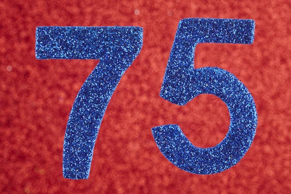 赤い背景の上 75 の青い色を番号します。Anniversar — ストック写真