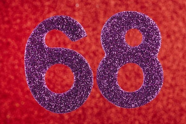 Číslo šedesát osm fialové barvy na červené pozadí. Anniversa — Stock fotografie