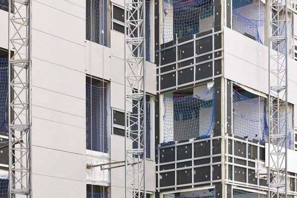 Building facade under construction. Insulation material and tile — Stock Photo, Image