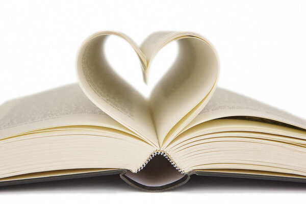Open book with heart shaped pages. Love for reading