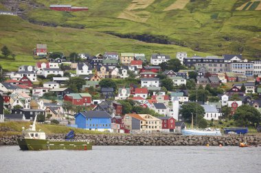Picturesque colorful village of Vestmanna in Feroe islands. Denm clipart