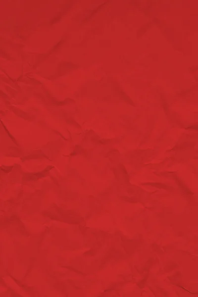 Roter zerknitterter faltiger texturierter Papierhintergrund. — Stockfoto
