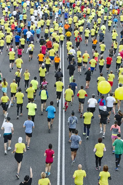 Runners on the street. Athletes in motion. Urban competition. Cr — Stock Photo, Image