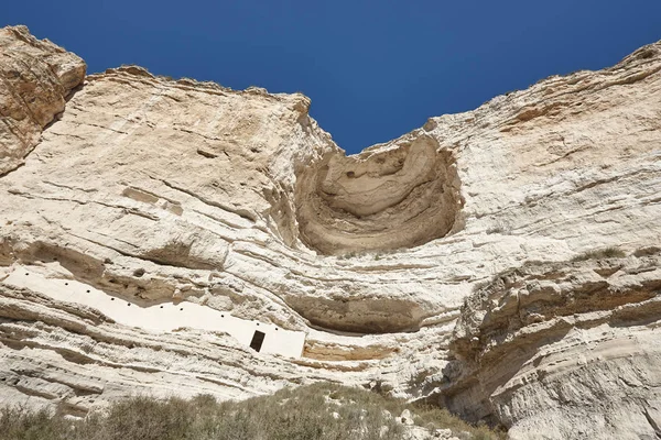 Primitive settlement cave excavated on the mountain rock. Albace