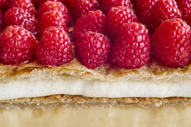 Delicious raspberry cake with puff pastry and cream. Homemade dessert 
