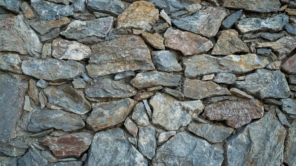 Texture de mur en pierre naturelle. Maçonnerie médiévale. Un ancien mur. Mur de briques de pierre. Texture macro. Architecture médiévale. De la maçonnerie brute. Texture de fond . — Photo