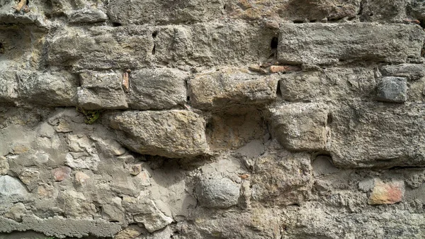 Textura de pared de piedra natural. Albañilería medieval. Antigua pared. Pared de ladrillo. Textura macro. Arquitectura medieval. Albañilería áspera. Textura de fondo . — Foto de Stock