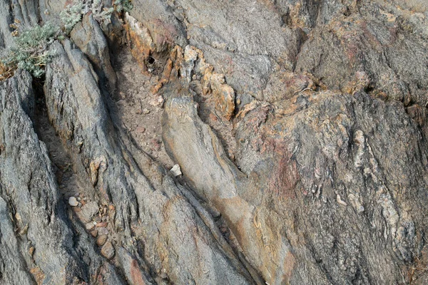 Textur aus Naturstein. Gesteinsstruktur. Klippenoberfläche. Schichtengestein. Schöner Naturstein. Sandstein. Die Natur. Reise. — Stockfoto