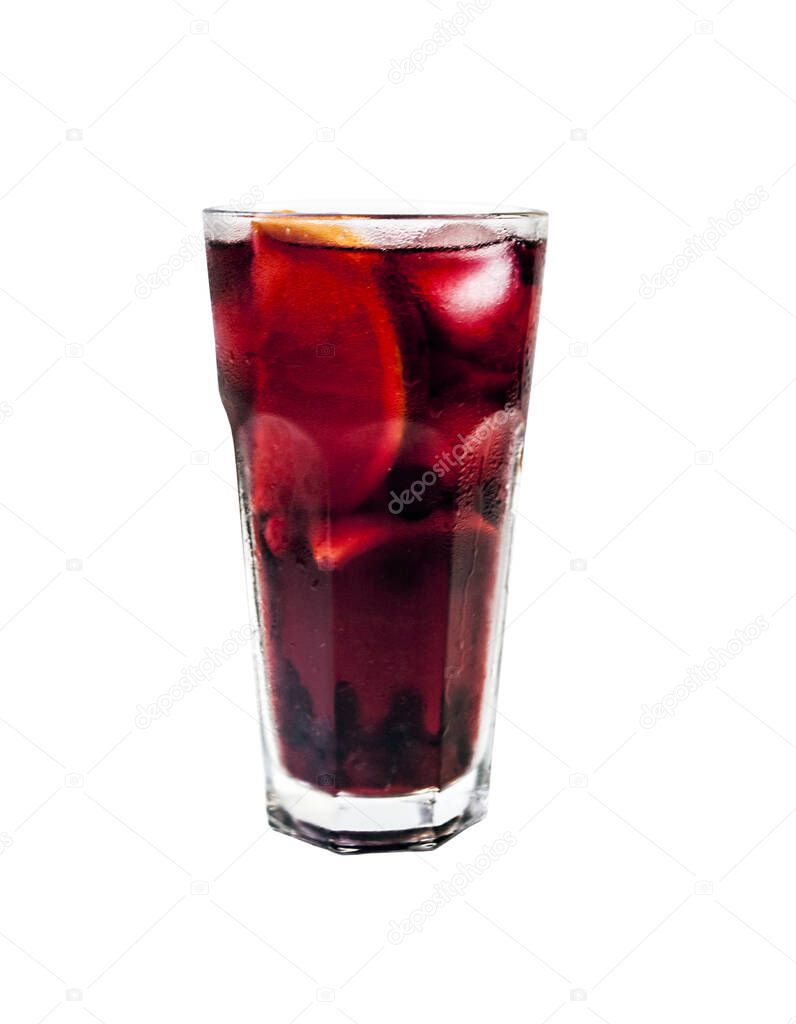 Cold homemade lemonade with cranberries, lemon and orange. Cranberry ice tea. Cocktail with lemon slices and ice cubes in a glass.  Isolated on white.