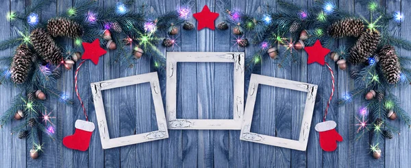 Kerstmis achtergrond met fotolijstjes, verlichting, gloeiende sta — Stockfoto