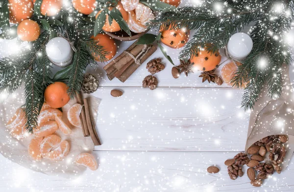 Christmas background with tangerines, spices and spruce. — Stock Photo, Image