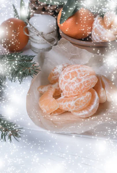 Christmas background with tangerines, spruce, candles, stars and snowflakes. — Stock Photo, Image