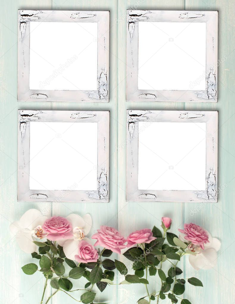 Wooden background with frames, roses and orchid flowers 