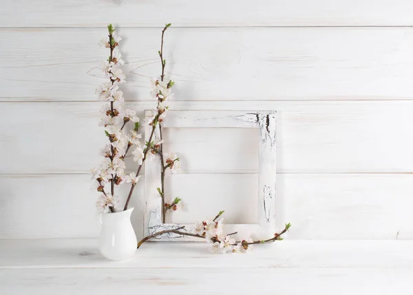 Decorated frame and apricot flowers in home interior