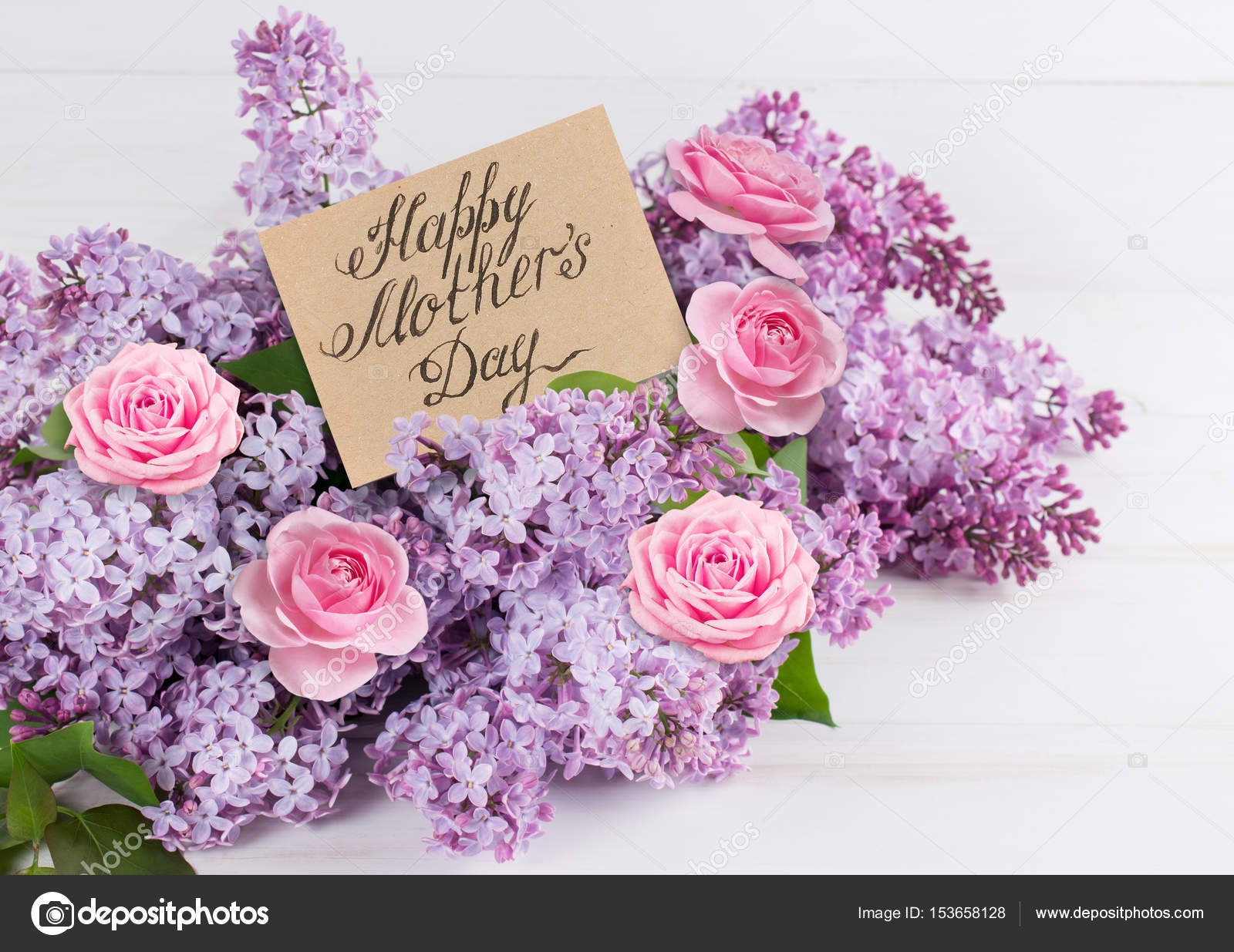 Lilac flowers and roses with paper greeting card for Mothers day — Stock Photo © Julia_Arda
