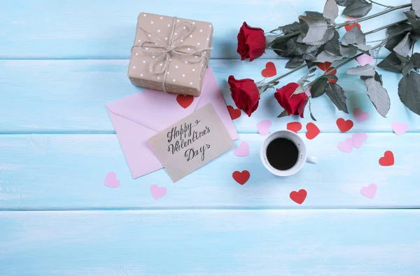 Valentine day. Top view of roses, hearts, gifts, coffee, envelope — Stock Photo, Image